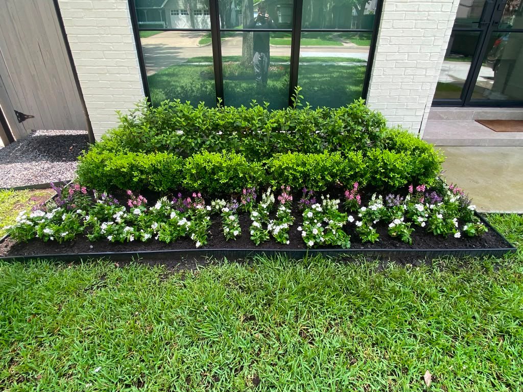Residential flower planting project by Rainlandscaping